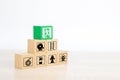 Close-up hand choose wooden toy blocks stacked in pyramid with door exit sing Royalty Free Stock Photo