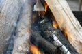 Fire. Closeup of pile of wood burning with flames in the fireplace Royalty Free Stock Photo