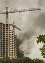 Fire At a construction site, unfinished multi-storey reinforced concrete building Royalty Free Stock Photo