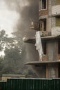 Fire At a construction site, unfinished multi-storey reinforced concrete building Royalty Free Stock Photo