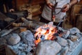 Fire crackling in blacksmith workshop of forging metal. Anonymouse craft smith create objects from wrought iron or steel