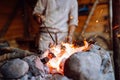 Fire crackling in blacksmith workshop of forging metal. Anonymouse craft smith create objects from wrought iron or steel