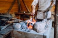 Fire crackling in blacksmith workshop of forging metal. Anonymouse craft smith create objects from wrought iron or steel