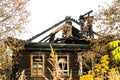 Fire-damaged traditional Russian wooden house izba in autumn. Gorokhovets Royalty Free Stock Photo