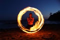 Fire Dance Along the Beach in the Dark Royalty Free Stock Photo