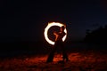 Fire Dance Along the Beach in the Dark Royalty Free Stock Photo