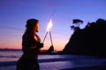 Fire Dance Along the Beach in the Dark Royalty Free Stock Photo