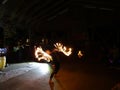 Fire Dancer Alexis Aaron spins fire around her body as people wa Royalty Free Stock Photo