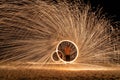 Fire dancer show amazing fire by swing on the beach at night time Royalty Free Stock Photo