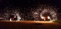 Fijian fire dancers on the beach spinning