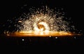 Fire dancers Spinning fire Show at night on the beach Royalty Free Stock Photo