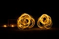 Fire dancing in dark night