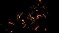 Fire sparks flying up. Glowing particles on a dark background textire for text or space