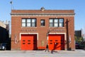 Fire Department firehouse in the city of Chicago, clear sunlit sky and buildings background Royalty Free Stock Photo