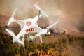 Fire Department Unmanned Aircraft System, UAS Drone Isolated Above a Forest Fire