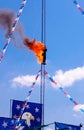 Fire Diver on Platform preparing to jump off a high dive platform into a pool of water.