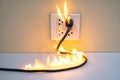 On fire electric wire plug Receptacle wall partition Royalty Free Stock Photo