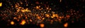 Fire embers particles over black Royalty Free Stock Photo