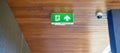Fire Emergency exit sign on the wall background inside building. Safety concept Royalty Free Stock Photo