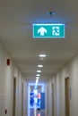 Fire Emergency exit sign on the wall background inside building. Safety concept Royalty Free Stock Photo