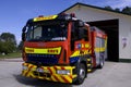 Fire and Emergency New Zealand Fire engine parking in a fire station Royalty Free Stock Photo