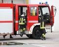 fire engine with many firefighters and equipment for fighting fire