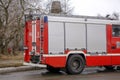 Fire Engine responding to an emergency driving with sirens and blue lights through the centre of Exeter