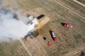 Fire engines extinguish straw top view