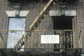 Fire escape and apartment for rent sign, South Bronx, New York