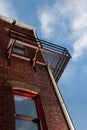 Fire escape on brick building from below Royalty Free Stock Photo