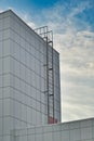 Fire escape ladder to the roof of modern building made of metal structures Royalty Free Stock Photo