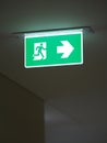 Fire escape sign on the ceiling fire exit arrow symbol