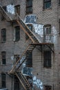 Fire escape stairs on an old building exterior in New York, Manhattan Royalty Free Stock Photo