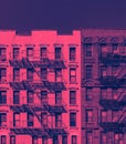 Fire escapes on the exterior of old buildings in New York City in pink and blue color Royalty Free Stock Photo