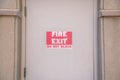 Fire Exit Do Not Block on a beige door at downtown Tucson, Arizona Royalty Free Stock Photo