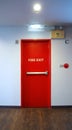 Fire exit emergency door red color metal material. Royalty Free Stock Photo