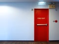 Fire exit emergency door red color metal material. Royalty Free Stock Photo