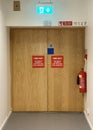Fire exit keep clear sign on building entry door Royalty Free Stock Photo