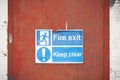 Fire exit keep clear sign on construction building site door Royalty Free Stock Photo