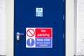 Fire exit keep clear sign on construction building site door Royalty Free Stock Photo