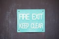 Fire exit keep clear sign on construction building site door Royalty Free Stock Photo