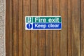 Fire exit keep clear sign on construction building site door Royalty Free Stock Photo