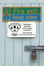 Fire exit keep clear sign on construction building site door Royalty Free Stock Photo