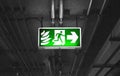 Fire exit sign in car park building Royalty Free Stock Photo