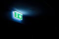 Fire Exit Sign in a dark room, with copy space