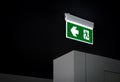 Fire exit sign. Green electric emergency evacuation escape sign with illuminated light. Royalty Free Stock Photo