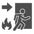 Fire exit solid icon. Emergency evacuation glyph style pictogram on white background. Flame and doorway with human Royalty Free Stock Photo