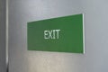 Fire exit white color and green background  sign photo Royalty Free Stock Photo