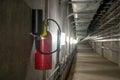 Fire extinguisher in dimly lit corridor