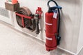 Fire extinguisher and fire hose reel in corridor Royalty Free Stock Photo